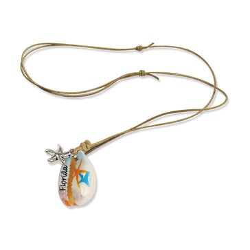 Hand-painted Florida cowrie shell necklace with silver starfish charm on adjustable natural rope cord, perfect beach jewelry for shell and starfish lovers.